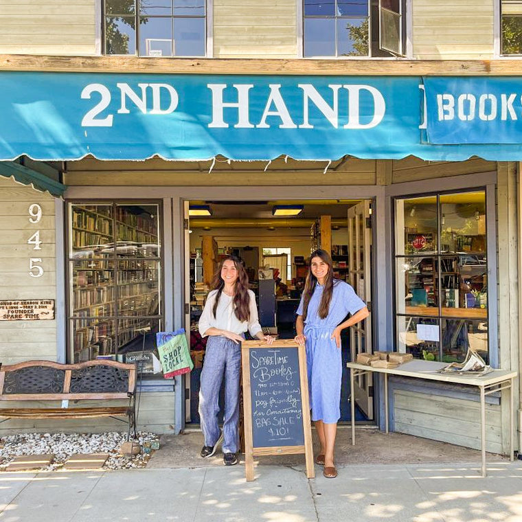 Two Besties in front of their newly purchased Used Bookshop 